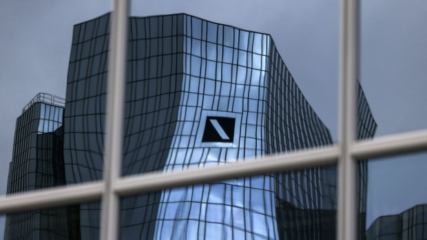 The headquarters of Deutsche Bank AG reflected in the windows of an office building in the financial district of Frankfurt, Germany, on Thursday, Feb. 2, 2023. Deutsche Bank vowed to increase profit and revenue further this year, after snapping a long streak of market share gains in trading in the final quarter of Chief Executive Officer Christian Sewing's turnaround plan.