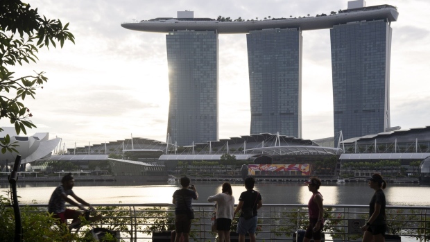 Crowds by the Merlion Park and Marina Bay Sands in Singapore, on Saturday, Oct. 8, 2022. Singapore is scheduled to announce its third quarter advanced gross domestic product (GDP) estimate on Oct 10, 2022.
