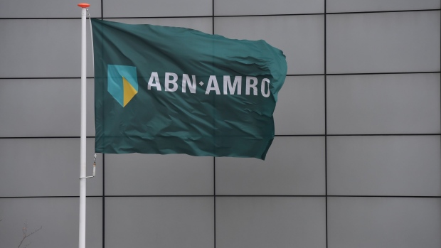 The logo for ABN Amro Group NV sits on a flag outside the company's headquarters in the Zuidas financial district in Amsterdam, Netherlands, on Tuesday, Jan. 7, 2020. The Dutch economy is estimated to grow 1.4% in 2020 and 1.1% in 2021, Dutch central bank said in a statement. Photographer: Geert Vanden Wijngaert/Bloomberg