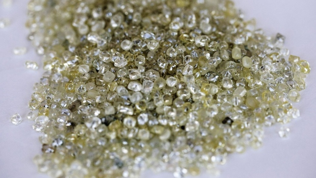 Rough diamonds sit on a sorting table at the Namibian Diamond Trading Co. (NTDC) diamond processing and valuation center, a joint venture between De Beers Group and Namdeb Diamond Corp. operated by Anglo American Plc, in Windhoek, Namibia, on Wednesday, June 14, 2017. The world's biggest diamond producer has spent $157 million on a state-of-the-art exploration vessel that will scour 6,000 square kilometers (2,300 square miles) of ocean floor for gems, an area about 65 percent bigger than Long Island.