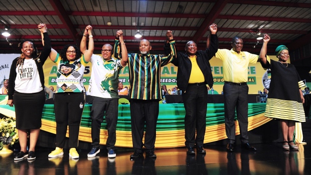 Maropene Ramokgopa, second deputy secretary general of the African National Congress (ANC), Nomvula Mokonyane, first deputy secretary general of the African National Congress, Fikile Mbalula, secretary general of the African National Congress, Gwede Mantashe, South Africa's mineral resources and energy minister, Cyril Ramaphosa, South Africa's president, Paul Mashatile, South Africa's deputy president, and Gwen Ramokgopa, treasurer general of the African National Congress (ANC) party, on day four of the 55th national conference of the African National Congress party in Johannesburg, South Africa, on Monday, Dec. 19, 2022. Ramaphosa comfortably won re-election as head of South Africa’s governing party just weeks after a scandal threatened to derail his political career, and now faces an uphill battle to rebuild its flagging support heading into a national vote in 2024.