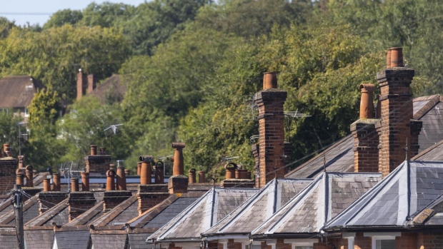 The rooftops and chimney stacks of residential properties in Guildford, UK, on Monday, Sept. 4, 2023. The downturn gripping the UK housing market steepened in August as the cost-of-borrowing squeeze sapped demand, according to a major mortgage lender. Photographer: Jason Alden/Bloomberg