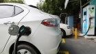 An electric vehicle (EV) is connected at a charging station operated by Energy Efficiency Services Ltd. (EESL), a joint venture between four state-run power companies -- NTPC Ltd., Power Grid Corp., Power Finance Corp. and REC Ltd., in New Delhi, India, on Tuesday, Aug. 25, 2020. India aspires to rapidly scale-up local manufacturing and adoption of electric vehicles to raise its competitiveness in the global auto-manufacturing industry as well as to tackle its high fuel import bill and urban pollution. Photographer T. Narayan/Bloomberg