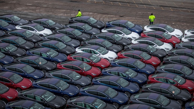 Automobiles produced by Tesla Inc. sit dockside after arriving on the Glovis Courage vehicles carrier vessel at the Port of Oslo in Oslo, Norway.