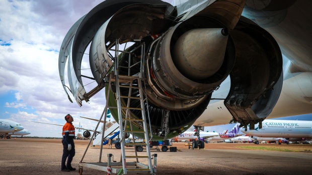Workers tends to the engine of an aircraft in Alice Springs, Australia.