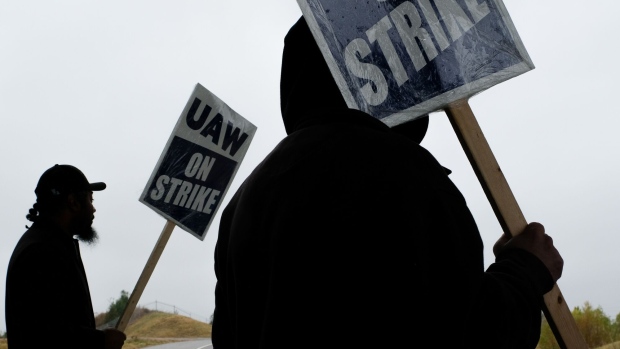 A "UAW On Strike" sign held on a picket line outside the General Motors Co. Spring Hill Manufacturing plant in Spring Hill, Tennessee, US, on Monday, Oct. 30, 2023. 