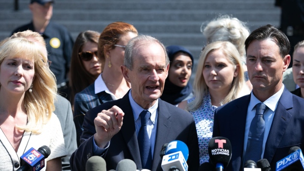 David Boies, representing several of Jeffrey Epstein's alleged victims, center, speaks to members of the media outside of federal court in New York, U.S., on Tuesday, Aug. 27, 2019. Epstein, a convicted pedophile, killed himself in prison earlier this month while awaiting trial on charges of conspiracy and trafficking minors for sex.