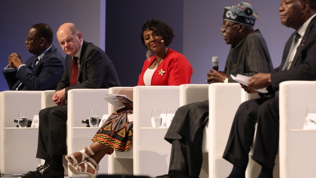 Olaf Scholz, second left, Macky Sall, left, Bola Ahmed Adekunle Tinubu and Alassane Ouattara, right, during the G20 Investment Summit on Nov. 20.