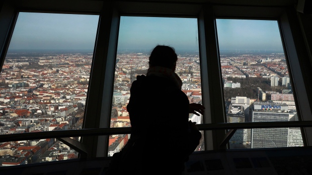A visitor looks out over the city skyline from the Berlin TV Tower in Berlin, Germany on Thursday, Feb. 9, 2023. Chancellor Olaf Scholz’s Social Democrats crashed to their worst-ever result in Berlin, failing to win an election in the German capital for the first time since 1999 as the conservative Christian Democrats surged to victory. Photographer: Krisztian Bocsi/Bloomberg