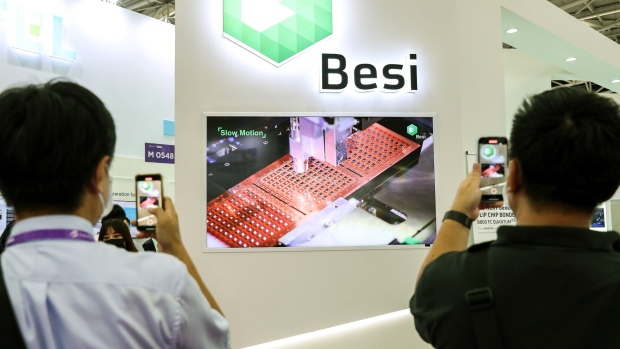 A presentation at the BE Semiconductor Industries booth at the Semicon Taiwan exhibition in Taipei, in September 2022. Photographer: I-Hwa Cheng/Bloomberg
