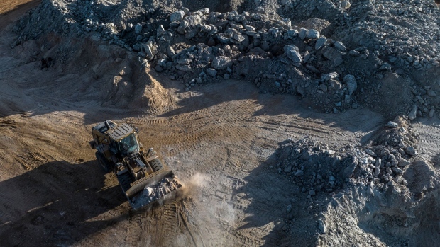 A bulldozer moves lithium ore at a mine in Brazil. Photographer: Dado Galdieri/Bloomberg