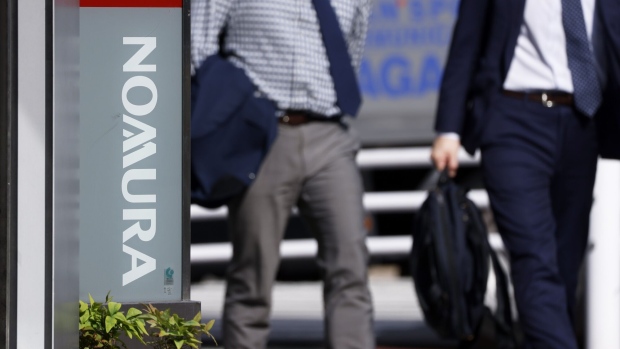 Signage for Nomura Holdings Inc. displayed outside a Nomura Securities Co. branch in Tokyo, Japan, on Monday, April 25, 2022. Nomura Holdings is scheduled to release earnings figures on April 25. Photographer: Kiyoshi Ota/Bloomberg