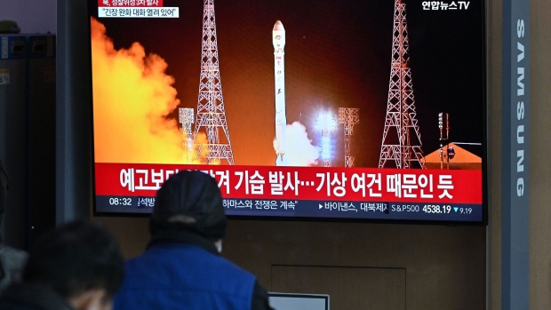 A news broadcast showing North Korea's latest satellite-carrying rocket launch, at a railway station in Seoul on Nov. 22. Photographer: Jung Yeon-Je/AFP/Getty Images