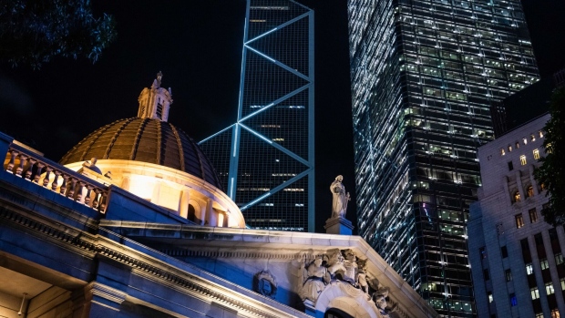The Statue of Justice stands above the Court of Final Appeal building in the Central district in Hong Kong. Photographer: Billy H.C. Kwok/Bloomberg