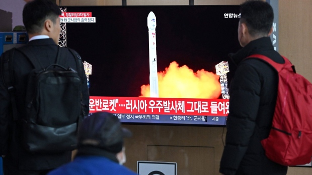 People watch a television screen showing a news broadcast with a picture of North Korea's latest satellite-carrying rocket launch, at a railway station in Seoul on November 22, 2023.  Photographer: Jung Yeon-Je/AFP/Getty Images
