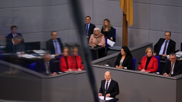 Olaf Scholz, Germany's chancellor, addresses lawmakers, on the Federal Constitutional Court's ruling on the €60 billion ($65.2 billion) climate fund, at the Bundestag in Berlin, Germany, on Tuesday, Nov. 28, 2023. Scholz promised that his government will forge ahead with investments needed to modernize the economy and maintain international competitiveness even after this month’s court ruling upended its budget planning.