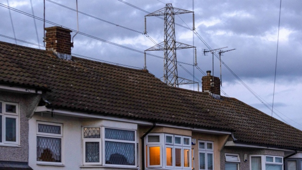 An electricity transmission tower near residential houses in Upminster, UK.