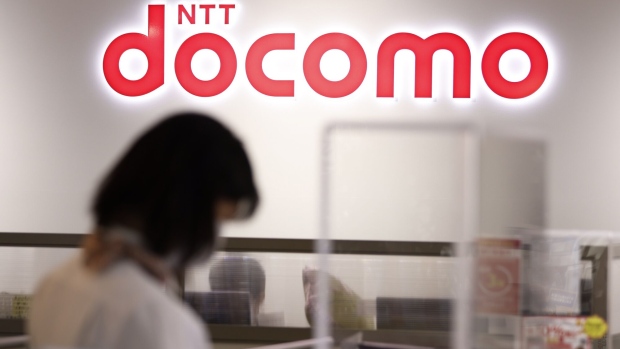 The NTT Docomo Inc. logo on display at the company's store store in the Marunouchi District of Tokyo, Japan, on Monday, Oct. 25, 2021. NTT Group announced its medium-term management strategy on Monday. Photographer: Kiyoshi Ota/Bloomberg