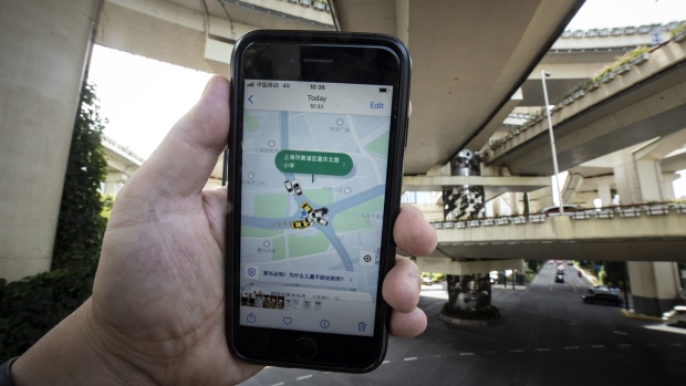 The Didi ride-hailing app on a smartphone arranged in Shanghai, China, on Monday, June 27, 2022. Didi's ordeal since it debuted in New York despite regulators’ objections has become one of the clearest object lessons in the dangers of doing business in China. Photographer: Qilai Shen/Bloomberg
