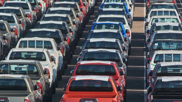 Lines of new Hilux automobiles in a parking lot ahead of distribution at the Toyota Motor Corp. manufacturing plant in Durban, South Africa, on Tuesday, Aug. 16, 2022. Floods earlier in the year caused extensive damage to the Toyota plant, one of the country's biggest car manufacturers. Photographer: Waldo Swiegers/Bloomberg