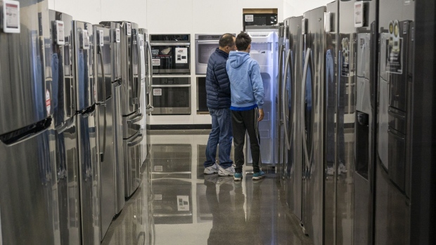 Shoppers browse appliances inside a Best Buy store on Black Friday in Union City, California, US, on Friday, Nov. 24, 2023. An estimated 182 million people are planning to shop from Thanksgiving Day through Cyber Monday, the most since 2017, according to the National Retail Federation. Photographer: David Paul Morris/Bloomberg