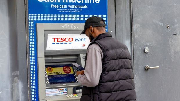 A Tesco Bank automated teller machine (ATM) at a Tesco Express Supermarket in London, UK, on Wednesday, Oct. 18, 2023. UK inflation failed to slow as forecast in September as rising oil prices offset downward pressures from food costs. Photographer: Betty Laura Zapata/Bloomberg