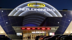 Cars sit parked outside a Cineplex Cinemas movie theater in Toronto, Ontario, Canada on Monday, Feb. 3, 2020. Britain's Cineworld Group Plc is on track to become North America's biggest operator of movie theaters with its plan to buy Canada's Cineplex Inc. for C$2.15 billion ($1.64 billion).