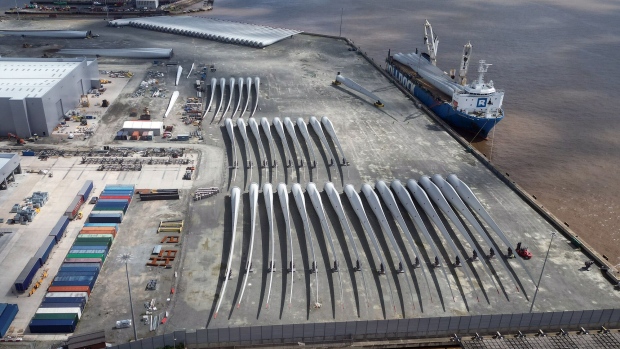 Wind turbine blades dockside during loading onto a ship at the Siemens Gamesa factory in Hull, UK, on Wednesday, Aug. 9, 2023. Siemens Energy AG launched a strategic review of its wind power business as problems with its turbines are expected to cause a 4.5 billion ($5 billion) net loss in one of industrial Germany's biggest debacles.