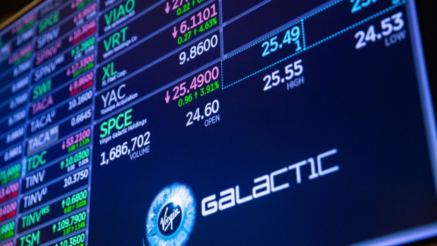 Virgin Galactic Holdings Inc. signage on the floor of the New York Stock Exchange (NYSE) in New York, U.S., on Monday, Aug. 23, 2021. U.S. futures rose Monday along with stocks in Europe as concerns about China's wealth crackdown faded and traders took advantage of last week's selloff to pick up equities at favorable valuations. Bonds declined as demand for havens eased.
