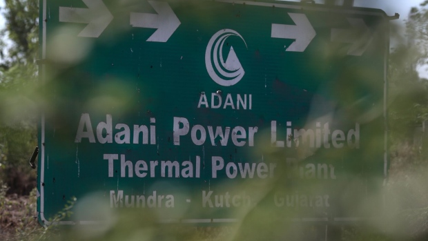 Signage of the Mundra Thermal Power Plant of Adani Power Ltd., sit on displayed in Mundra, Gujarat, India, on Thursday, Feb. 9, 2023. The Mundra Thermal Power Plant, which can light up millions of homes, has more liabilities than assets and has run up $1.8 billion of losses.