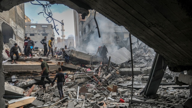 Residents inspect destruction caused by air strikes in Khan Yunis, Gaza on Dec. 4.