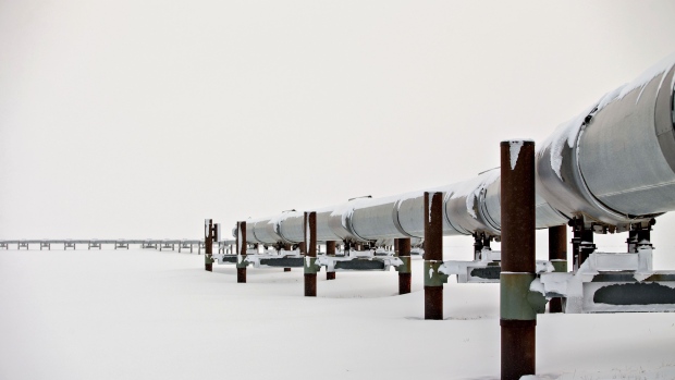 The first mile of the 800-mile Trans-Alaska Pipeline extends across the frozen tundra near the Alyeska Pipeline Services Co. pump station in Prudhoe Bay, Alaska, U.S., on Thursday, Feb. 16, 2017. Four decades after the Trans Alaska Pipeline System went live, transforming the North Slope into a modern-day Klondike, many Alaskans fear the best days have passed. Photographer: Daniel Acker/Bloomberg