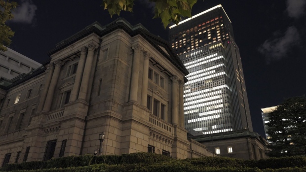 The Bank of Japan (BOJ) headquarters at dusk in Tokyo, Japan, on Tuesday, Nov. 14, 2023. Japan’s economy slipped back into reverse over the summer, underscoring the fragility of the country’s recovery and backing the case for continued support from the Bank of Japan and the government. Photographer: Kosuke Okahara/Bloomberg