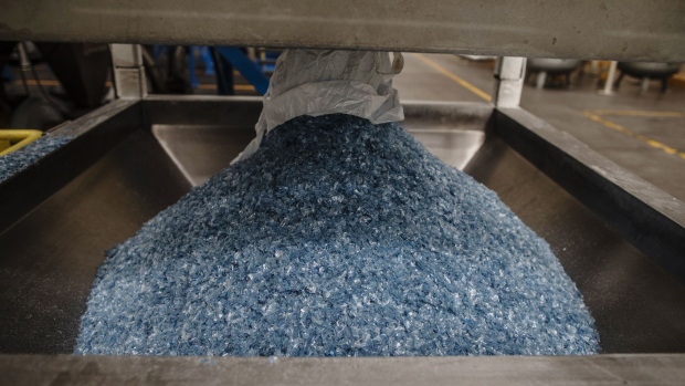 Ground plastic flakes fall from a machine at a PET recycling plant in Toluca, Mexico, in 2019. Photographer: Alejandro Cegarra/Bloomberg