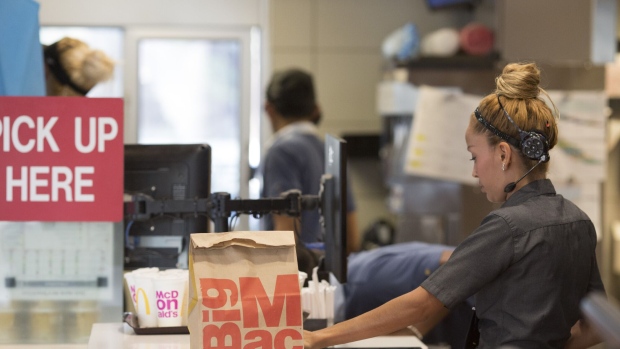 An employee packs an order for a customer at a McDonald's restaurant in Phoenix, Arizona.