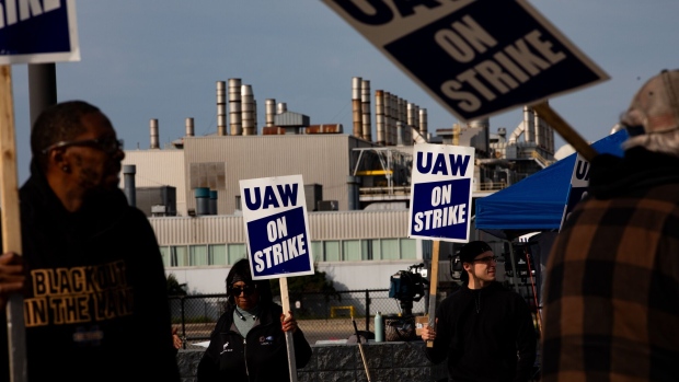United Auto Workers (UAW) members and supporters on a picket line outside the Ford Motor Co. Michigan Assembly plant in Wayne, Michigan, US, on Wednesday, Sept. 20, 2023. The United Auto Workers said more of its members will go on strike at General Motors Co., Ford Motor Co. and Stellantis NV facilities starting at noon Friday unless substantial headway is made toward new labor contracts.