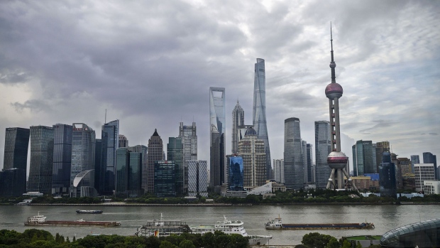 SHANGHAI, CHINA - AUGUST 28: Boats travel on the Huangpu River as the skyline of the city is is seen, including the Oriental Pearl TV Tower and the Shanghai Tower, on August 28, 2020 in Shanghai, China. Photographer: Kevin Frayer/Getty Images