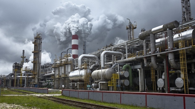 Emissions rise from a smokestack at the PKN Orlen SA oil refinery in Plock, Poland, on Friday, July 17, 2020. Polish refiner PKN Orlen won conditional European Union approval to buy rival Grupa Lotos SA after agreeing on a “extensive” commitments package designed to allay potential competition concerns.