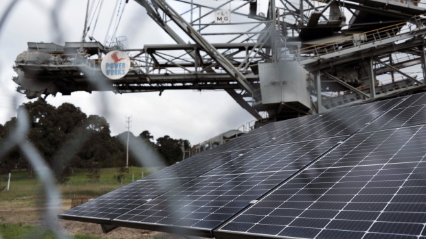 Old coal mining equipment next to solar panels at the PowerWorks Energy Education Centre in Morwell, Australia, on Dec. 1.
