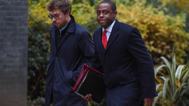 Bim Afolami, UK economic secretary to the treasury, right, arrives for a meeting of cabinet ministers at 10 Downing Street in London, UK, on Tuesday, Nov. 14, 2023. UK Prime Minister Rishi Sunak appointed David Cameron as UK foreign secretary, a shock return to government for a man who led the UK between 2010 and 2016 but whose legacy is defined by his decision to call the Brexit referendum. Photographer: Chris J. Ratcliffe/Bloomberg