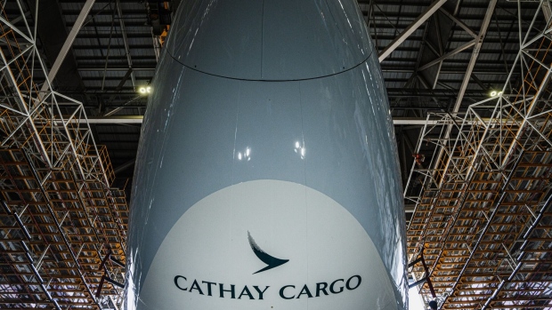 An aircraft operated by Cathay Cargo, the cargo unit of Cathay Pacific Airways Ltd., during a ceremony marking its rebranded livery at a HAECO Group hanger at Hong Kong International Airport on Wednesday, June 21, 2023. Cathay is one of the world's largest cargo airlines by freight capacity offered, operating out of Hong Kong, the world's busiest cargo hub. Photographer: Lam Yik/Bloomberg