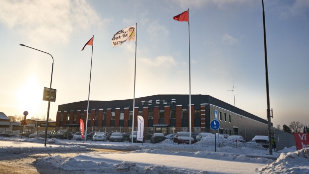 Banners from IF Metall union during a labor protest outside the Tesla Inc. service center in Segeltorp, Sweden, on Tuesday, Dec. 5, 2023. Tesla's deliveries to Sweden are at risk of being blocked from across the Nordic region after unions asked their neighboring peers to bolster their weeks-long strike.