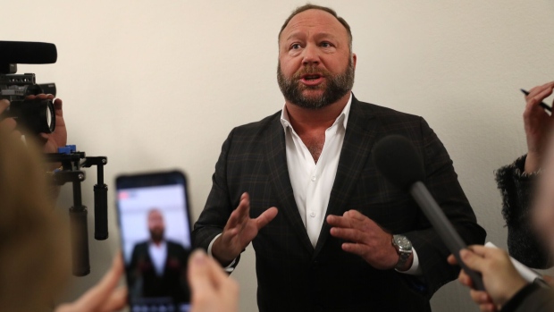 Alex Jones, radio host and creator of the website InfoWars, speaks to members of the media before a House Judiciary Committee hearing with Sundar Pichai, chief executive officer of Google Inc., not pictured, in Washington, D.C., U.S., on Tuesday, Dec. 11, 2018. Pichai backed privacy legislation and denied the company is politically biased, according to a transcript of testimony he plans to deliver.