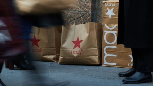 Shopping bags in front of the Macy's Inc. flagship store in the Herald Square area of New York, US, on Monday, Nov. 13, 2023.  Photographer: Bing Guan/Bloomberg