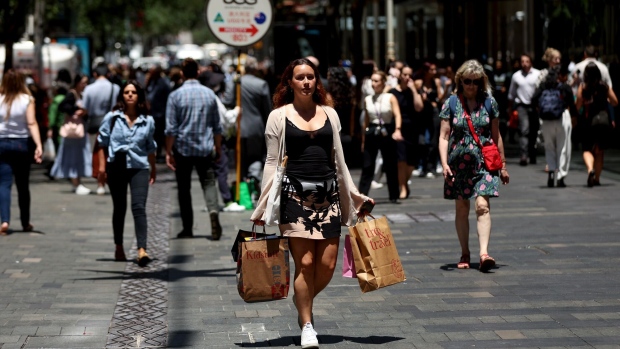 A shopper walks with bags on Pitt Street Mall in Sydney, Australia, on Wednesday, Nov. 22, 2023. Australia’s remaining inflation challenge is “increasingly homegrown and demand driven” compared with earlier supply-side disruptions, with implications for policy, Reserve Bank Governor Michele Bullock said. Photographer: Brendon Thorne/Bloomberg