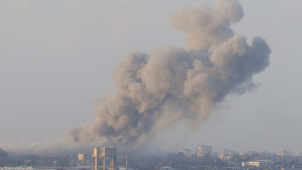 Smoke rises following Israeli air strikes in Gaza on Dec. 6.