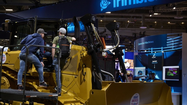 Attendees at the Trimble vendor booth during the ConExpo-Con/Agg tradeshow in Las Vegas, Nevada, US, on Tuesday, March 14, 2023. The convention, which takes place every three years, expects 130,000 attendees.