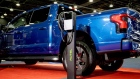 An Autel A/C residential electric vehicle charger beside a 2022 Ford F-150 Lighting electric truck during the 2023 North American International Auto Show (NAIAS) in Detroit, Michigan, US, on Thursday, Sept. 14, 2023. The event showcases over 20 attractions, events, and shows about vehicles and the ever-growing technology behind them.