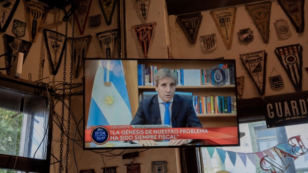 Luis Caputo delivers a recorded speech on economic measures in Buenos Aireson Dec. 12. Photographer: Anita Pouchard Serra/Bloomberg