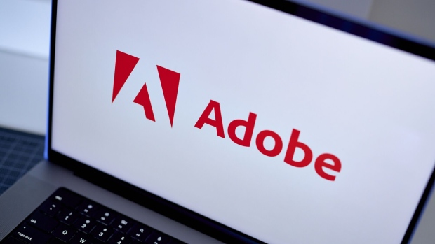 The Adobe logo on a laptop arranged in the Brooklyn borough of New York, US, on Friday, July 28, 2023. Adobe Inc.s $20 billion takeover of design startup Figma Inc. is on course for an in-depth investigation from European Union merger regulators, adding to growing global scrutiny of the deal dubbed by Adobes boss as transformational. Photographer: Gabby Jones/Bloomberg